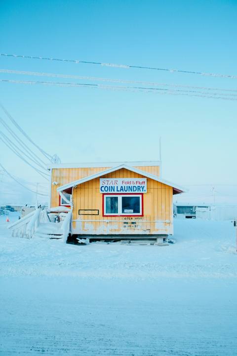 Wooden home on snow-covered ground